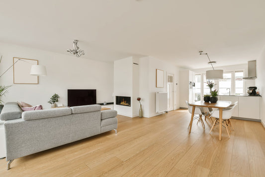 a living room with light wood laminate flooring