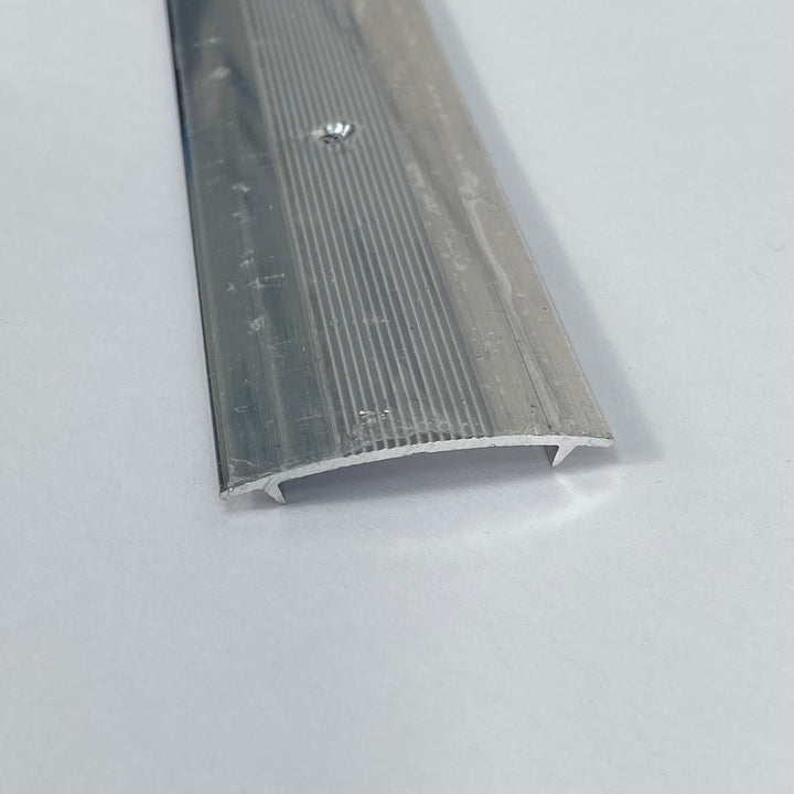 A silver-colored aluminum cover strip